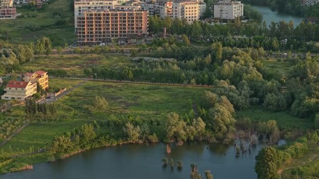 Aerial view of modern buildings and a lake in Tirane Albania. Aerial view of modern buildings and a lake in Tirane Albania.