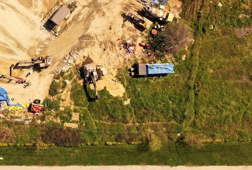Aerial view of heavy machinery and excavators working on a construction site in Avcilar Istanbul Turkiye. Aerial view of heavy machinery and excavators working on a construction site in Avcilar Istanbul Turkiye.