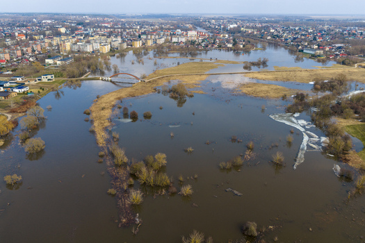 Aerial view of the flooded river plain with a pedestrian bridge and melting ice near the town of Kedainiai Kaunas County Lithuania. Aerial view of the flooded river plain with a pedestrian bridge and melting ice near the town of Kedainiai Kaunas County Lithuania.