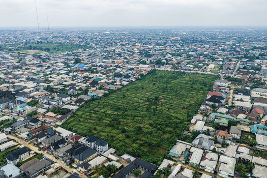Port Harcourt Rivers Nigeria 03 July 2026 Aerial view of a large green plot of land surrounded by dense residential housing and rooftops in Port Harcourt Nigeria. Port Harcourt Rivers Nigeria 03 July 2026 Aerial view of a large green plot of land surrounded by dense residential housing and rooftops in Port Harcourt Nigeria.