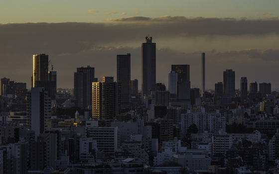 View of the city s buildings bathed in the warm embrace of the setting sun casting long shadows over the cityscape Bunkyo City Tokyo Japan. View of the city s buildings bathed in the warm embrace of the setting sun casting long shadows over the cityscape Bunkyo City Tokyo Japan.