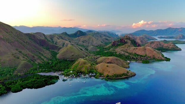Aerial view of Komodo National Park hills and turquoise sea Indonesia. Aerial view of Komodo National Park hills and turquoise sea Indonesia.