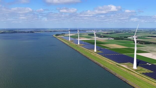 Aerial view of wind turbines and solar farm in Netherlands.