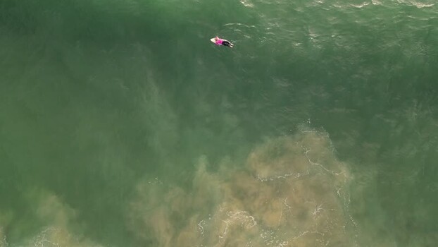Aerial view of surfer at Praia da Mata Portugal. Aerial view of surfer at Praia da Mata Portugal.