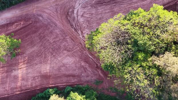 Aerial view of red soil and trees in Araras Brazil. Aerial view of red soil and trees in Araras Brazil.