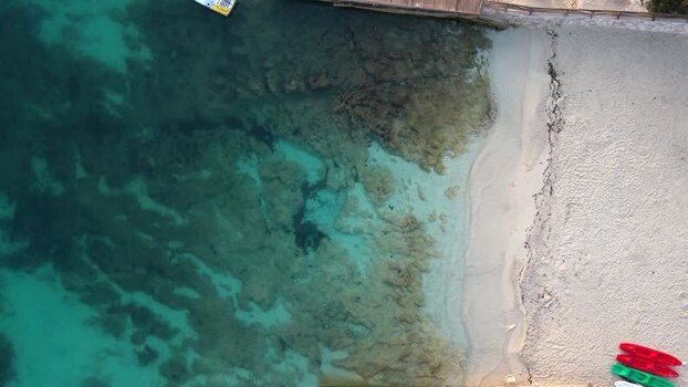 Aerial view of beach with kayaks in Ksamil Albania.