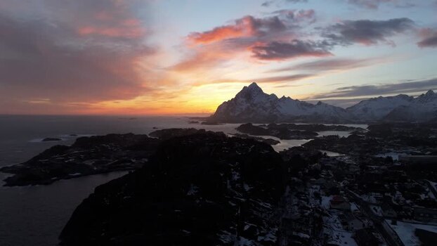 Aerial view of Lofoten mountains at sunset in Norway.