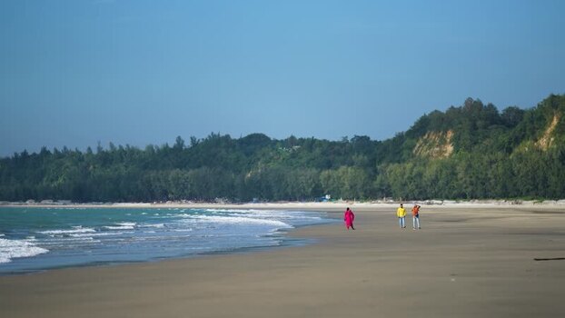 View of people walking on the beach at Cox s Bazar Bangladesh. View of people walking on the beach at Cox s Bazar Bangladesh.