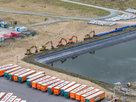 Grunheide Mark Brandenburg Germany 07 September 2026 Aerial view of the Tesla Gigafactory construction site showing excavators near a reservoir and rows of logistics trailers. Grunheide Mark Brandenburg Germany 07 September 2026 Aerial view of the Tesla Gigafactory construction site showing excavators near a reservoir and rows of logistics trailers.