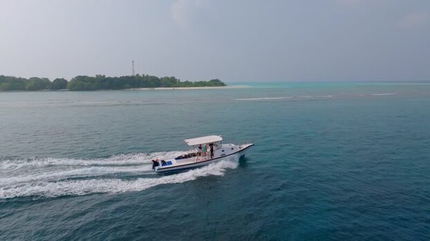 Aerial view of boat sailing on sea Maldives.