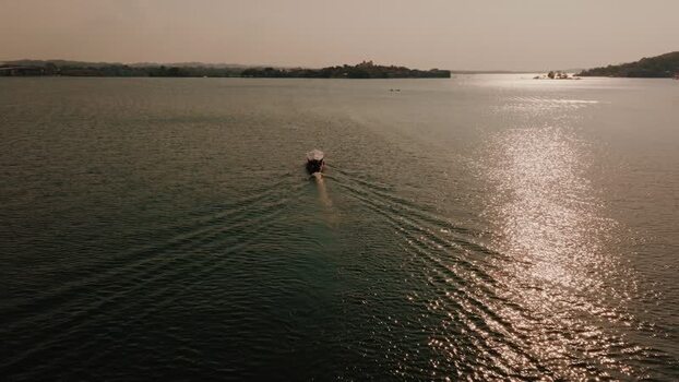Aerial view of boat on Lake Peten Itza near Island of Flores Guatemala.