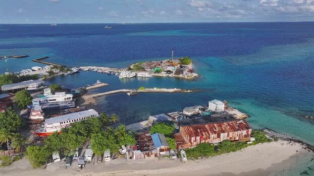 Aerial view of Gulhi island harbor and turquoise waters Maldives. Aerial view of Gulhi island harbor and turquoise waters Maldives.