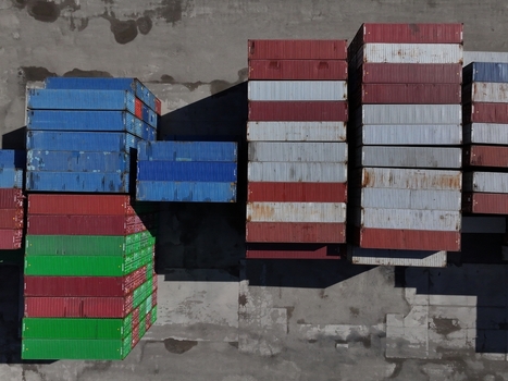 Aerial view of colorful shipping containers stacked in rows at a logistics terminal Cincinnati OH United States.