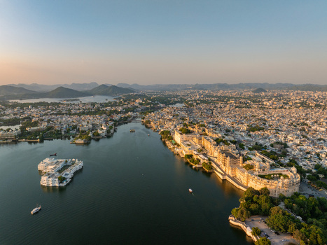 Aerial view of the City Palace and Lake Palace on Lake Pichola in Udaipur Rajasthan India.