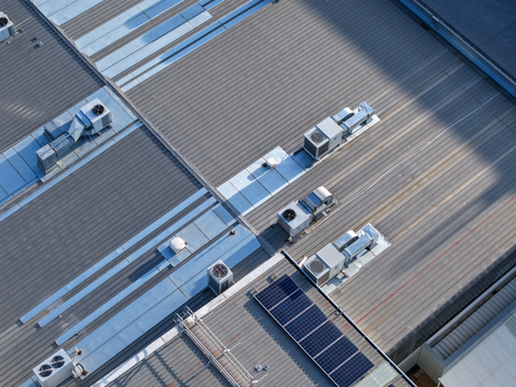 Melbourne Australia 22 September 2026 Aerial view of industrial factory rooftops in Kilsyth featuring metal roofing HVAC ventilation units and solar panels. Melbourne Australia 22 September 2026 Aerial view of industrial factory rooftops in Kilsyth featuring metal roofing HVAC ventilation units and solar panels.