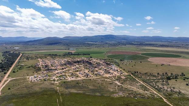 Aerial view of the Alma settlement with scattered houses and circular irrigation fields against rolling hills in Waterberg District Municipality Limpopo South Africa. Aerial view of the Alma settlement with scattered houses and circular irrigation fields against rolling hills in Waterberg District Municipality Limpopo South Africa.