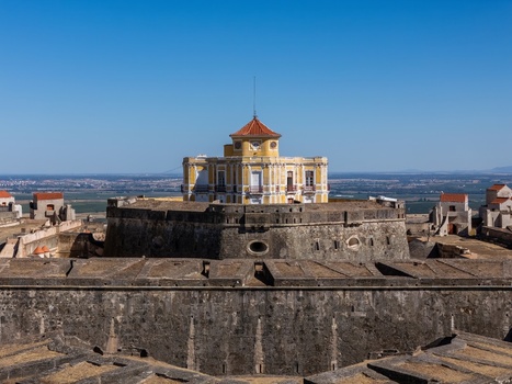 Elvas Portugal 10 September 2026 Aerial view of Forte de Nossa Senhora da Graca a historic star shaped fortress with stone walls and a central yellow building under a clear blue sky. Elvas Portugal 10 September 2026 Aerial view of Forte de Nossa Senhora da Graca a historic star shaped fortress with stone walls and a central yellow building under a clear blue sky.