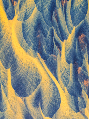 Aerial view of intricate glacial river channels and dark volcanic sand patterns forming abstract textures across the landscape in Iceland. Aerial view of intricate glacial river channels and dark volcanic sand patterns forming abstract textures across the landscape in Iceland.