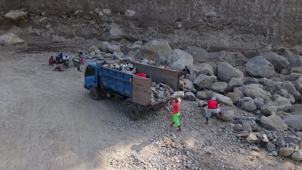 Aerial view of workers with truck in quarry Indonesia. Aerial view of workers with truck in quarry Indonesia.