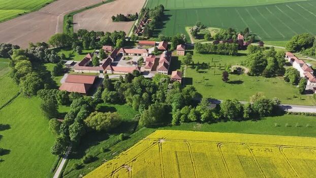 Aerial view of a historic farm estate and lush fields Germany. Aerial view of a historic farm estate and lush fields Germany.