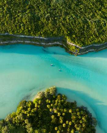 Aerial view of turquoise waters embracing verdant isles a symphony of nature s artistry unfolds from above Ouvéa Loyalty Islands Province New Caledonia. Aerial view of turquoise waters embracing verdant isles a symphony of nature s artistry unfolds from above Ouvéa Loyalty Islands Province New Caledonia.