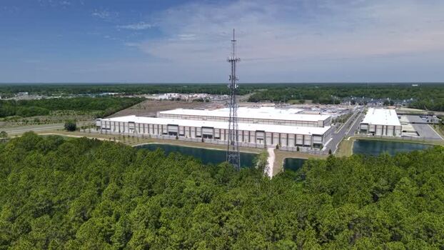 Aerial view of industrial warehouses and a cell tower United States Aerial view of industrial warehouses and a cell tower United States