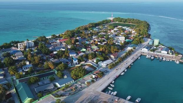 Aerial view of Vashafaru island with harbor and turquoise waters Maldives. Aerial view of Vashafaru island with harbor and turquoise waters Maldives.