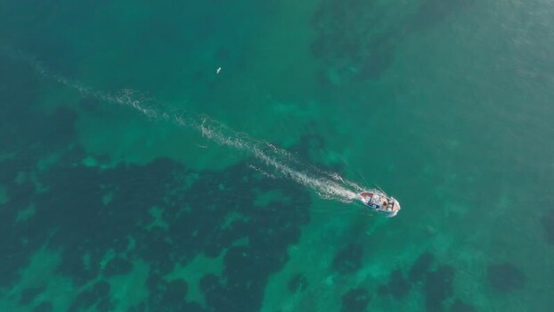 Aerial view of a fishing boat near Island of Ortigia Italy. Aerial view of a fishing boat near Island of Ortigia Italy.