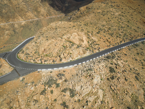 Aerial view of a turn of the famous winding mountain road that links the small towns of Casillas del &Aacute;ngel and P&aacute;jara in Fuerteventura Canary Islands.