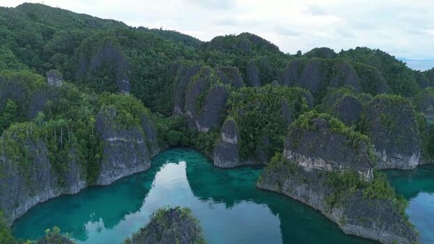 Aerial view of Piaynemo karst islands in Papua Barat Indonesia. Aerial view of Piaynemo karst islands in Papua Barat Indonesia.