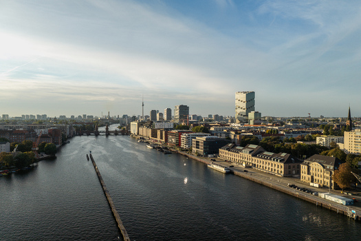 Aerial view of Spreespeicher Promenade along the Spree river with modern and historic buildings in the cityscape of Berlin Berlin Germany. Aerial view of Spreespeicher Promenade along the Spree river with modern and historic buildings in the cityscape of Berlin Berlin Germany.