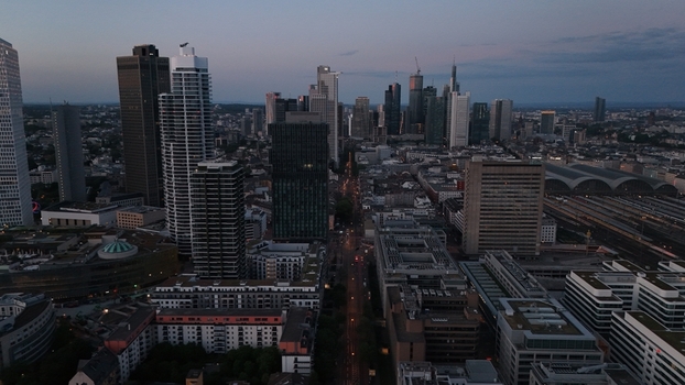 Aerial view of the Frankfurt am Main skyline featuring modern skyscrapers and urban architecture during twilight in Frankfurt am Main Hessen Germany. Aerial view of the Frankfurt am Main skyline featuring modern skyscrapers and urban architecture during twilight in Frankfurt am Main Hessen Germany.
