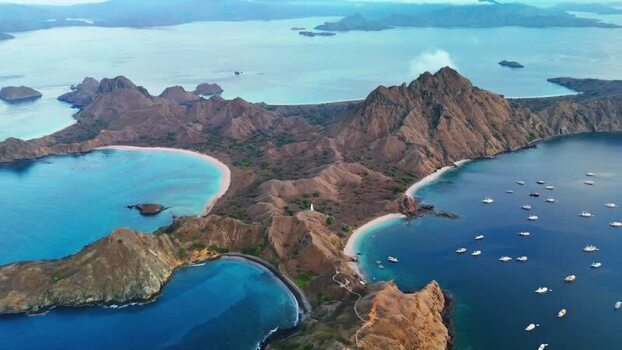 Aerial view of Komodo National Park with turquoise bays and boats Indonesia. Aerial view of Komodo National Park with turquoise bays and boats Indonesia.