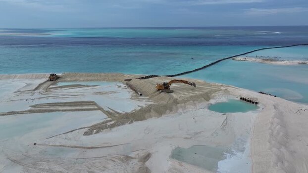 Aerial view of land reclamation and excavators in Gulhi Maldives.
