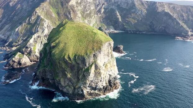 Aerial view of Tormore Island sea stack Ireland.
