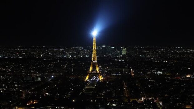 Aerial view of the illuminated Eiffel Tower at night France. Aerial view of the illuminated Eiffel Tower at night France.