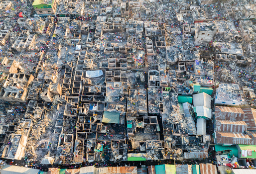 Aerial view of a densely packed urban landscape reveals a chaotic tapestry of rooftops and structures painted in muted tones of grey and brown Dhaka Dhaka Division Bangladesh. Aerial view of a densely packed urban landscape reveals a chaotic tapestry of rooftops and structures painted in muted tones of grey and brown Dhaka Dhaka Division Bangladesh.
