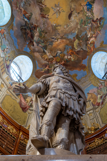 Vienna Austria 26 April 2026 View of the marble statue of Emperor Charles VI under the magnificent frescoed dome in the State Hall of the Austrian National Library. Vienna Austria 26 April 2026 View of the marble statue of Emperor Charles VI under the magnificent frescoed dome in the State Hall of the Austrian National Library.