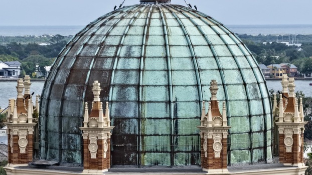 Aerial view of the weathered copper dome of the Memorial Presbyterian Church with intricate architectural details in St. Augustine Florida United States.