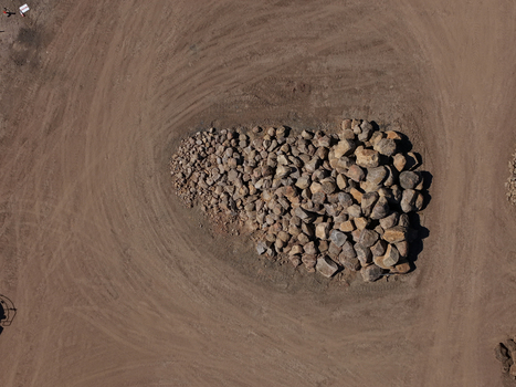 Aerial view of a large pile of boulders and rocks situated in a dirt lot at a construction site in Kilsyth Victoria Australia. Aerial view of a large pile of boulders and rocks situated in a dirt lot at a construction site in Kilsyth Victoria Australia.
