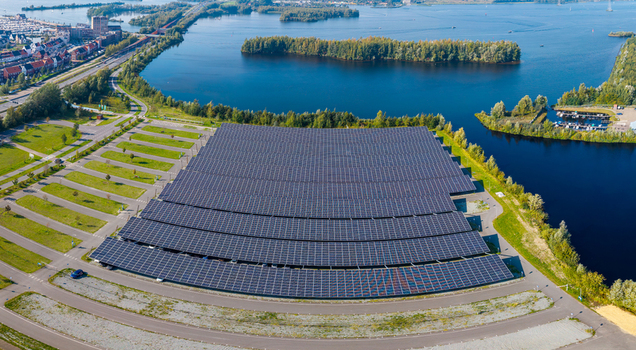 Aerial view of the Zonneweide solar panel array covering a large parking lot near the water in Harderwijk Gelderland Netherlands.