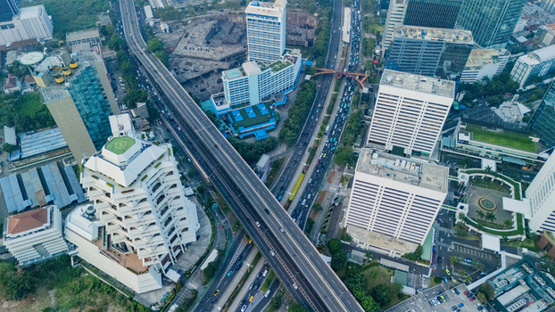 Aerial view of the modern skyline and highway interchange in Jakarta Indonesia.