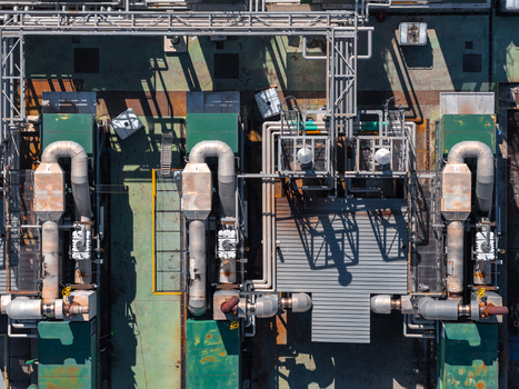 Aerial view of industrial machinery and complex piping systems at a manufacturing facility in Spoleto Umbria Italy. Aerial view of industrial machinery and complex piping systems at a manufacturing facility in Spoleto Umbria Italy.