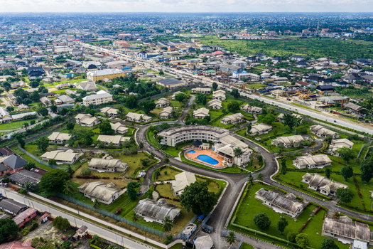 Port Harcourt Nigeria 03 July 2026 Aerial view of a residential complex with a central swimming pool surrounded by lush green lawns and suburban houses in Port Harcourt Nigeria. Port Harcourt Nigeria 03 July 2026 Aerial view of a residential complex with a central swimming pool surrounded by lush green lawns and suburban houses in Port Harcourt Nigeria.