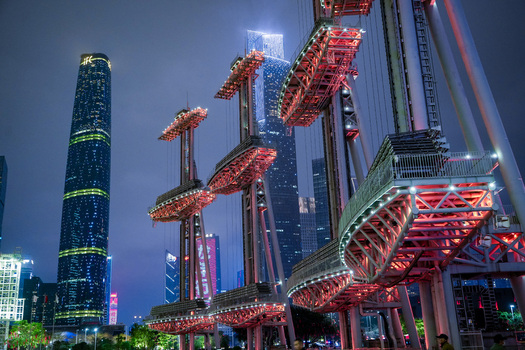 Guangzhou China 24 February 2024 View of Haixin Bridge illuminated at night with the Guangzhou International Finance Center and modern skyscrapers in the background. Guangzhou China 24 February 2024 View of Haixin Bridge illuminated at night with the Guangzhou International Finance Center and modern skyscrapers in the background.