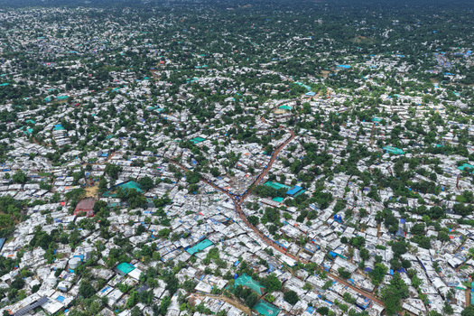 Aerial view of Camp 7 Kutupalang Expansion Sites showing dense rows of shelters with white roofs and green trees in Cox s Bazar District Chittagong Division Bangladesh.