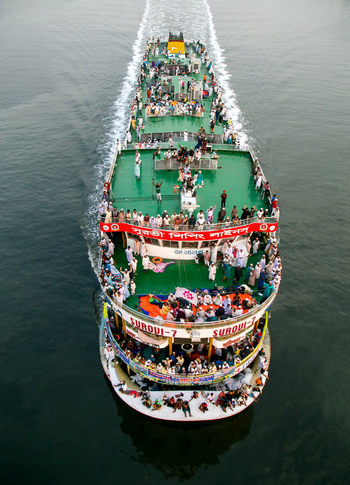 Dhaka Bangladesh 04 April 2026 Aerial view of a vibrant bustling ferry boat teeming with passengers creating a lively scene on the serene waters.. Dhaka Bangladesh 04 April 2026 Aerial view of a vibrant bustling ferry boat teeming with passengers creating a lively scene on the serene waters..
