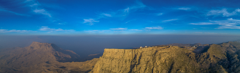 View of the rugged cliffs and plateau of Gorakh Hill Station under a clear blue sky in Gorakh Hill Sindh Pakistan.