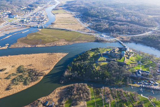 Aerial view of Bohus Fortress situated on a rocky outcrop surrounded by the river and wetlands in Kungalv Vastra Gotalands lan Sweden. Aerial view of Bohus Fortress situated on a rocky outcrop surrounded by the river and wetlands in Kungalv Vastra Gotalands lan Sweden.