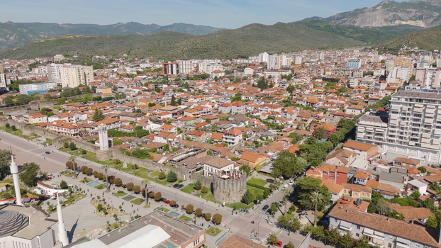 Aerial view of the historic Elbasan Castle walls surrounded by traditional terracotta rooftops and modern urban architecture in Elbasan Elbasan County Albania.